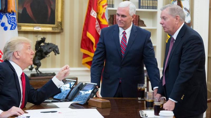 President Trump, Vice President Pence, and Senator Graham in a meeting