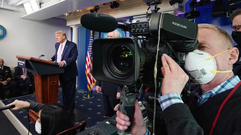President Donald J. Trump, joined by Vice President Mike Pence and members of the White House Coronavirus Task Force, listens to a reporter’s question during a coronavirus update briefing Friday, April 10, 2020