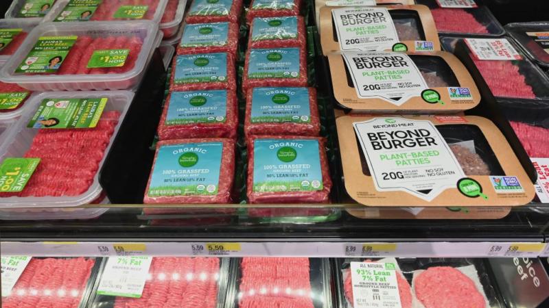 Grocery shelves stocked with ground beef