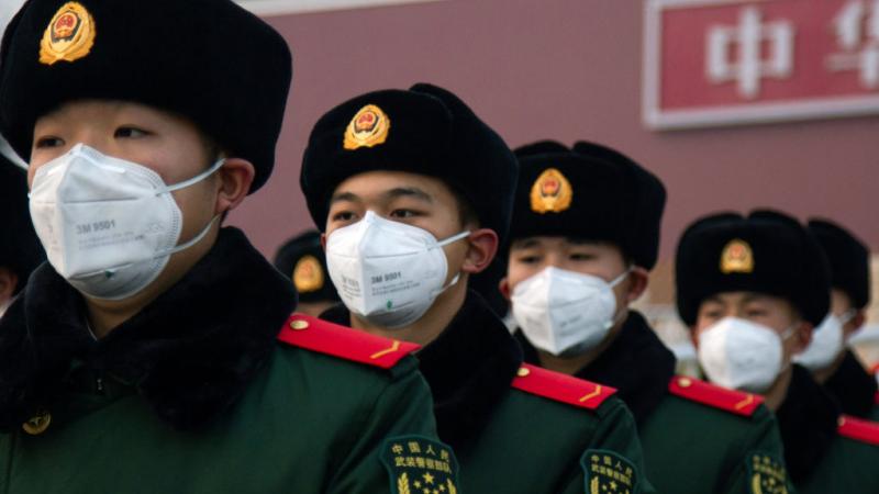 Chinese police officers wearing masks in January 2020