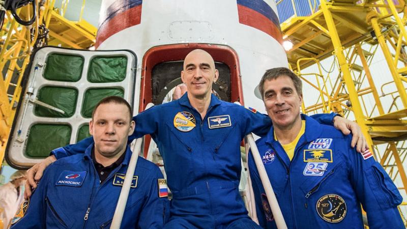 At the Baikonur Cosmodrome in Kazakhstan, Expedition 63 crew members Ivan Vagner (left) and Anatoly Ivanishin (center) of Roscosmos and NASA astronaut Chris Cassidy (right) pose for pictures April 3 in front of their Soyuz spacecraft as part of their prelaunch activities. They will launch April 9 on the Soyuz MS-16 spacecraft from Baikonur on April 9 for a six-and-a-half-month mission on the International Space Station.