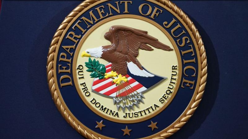 DOJ seal on a lecturn in 2018