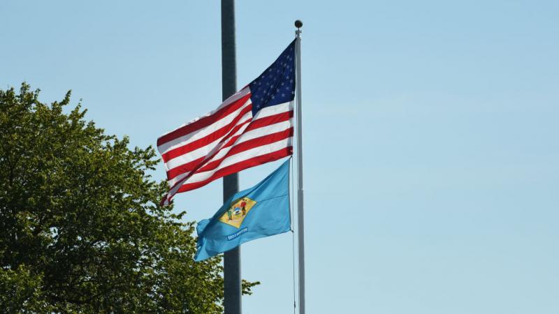 American flag and Delaware flag in 2019
