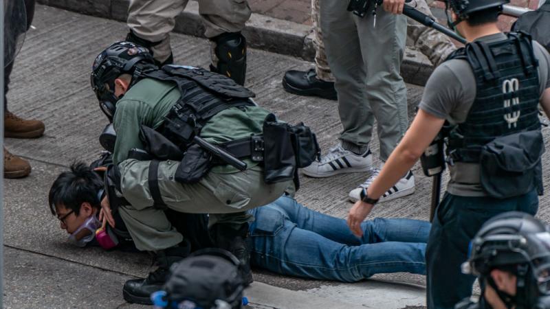 Pro-democracy supporter detained by riot police in Hong Kong on May 24, 2020