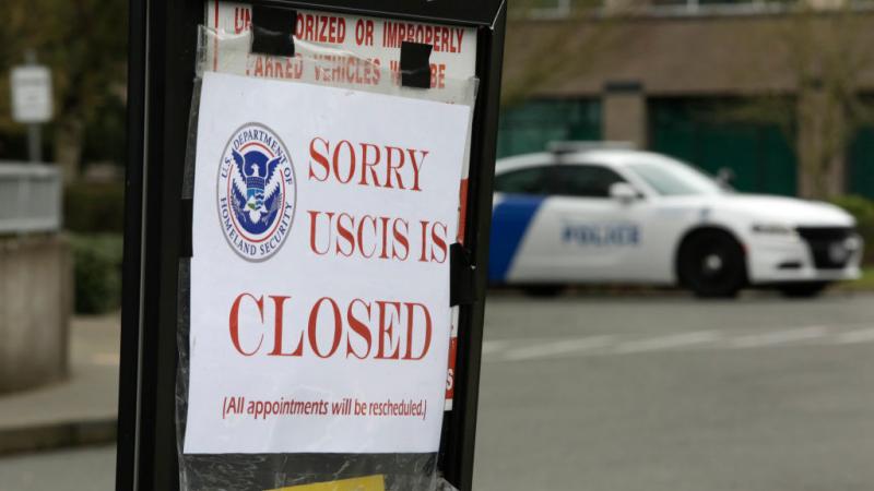 A sign marking a USCIS closure