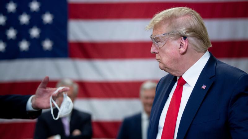 President Trump touring a factory producing masks in May 2020