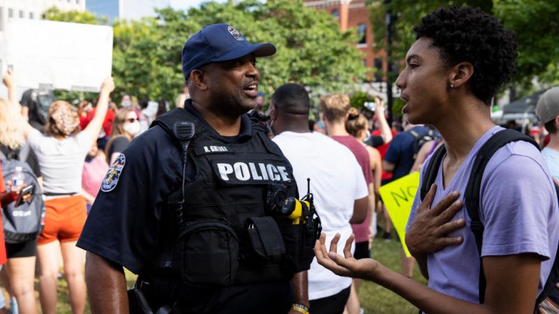Louisville Metro Police Department member speaking to protestor on June 5, 2020
