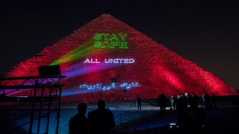 The Great Pyramid of Kheops at the Giza plateau in the Egyptian capital of Cairo, displaying a message to stay home during the coronavirus pandemic