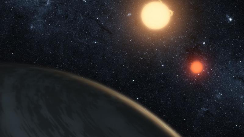 Artist's conception of Kepler-16b around a binary star system