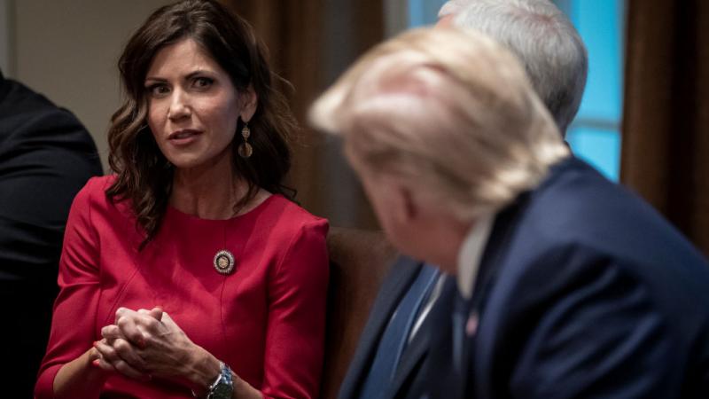 South Dakota Gov. Kristi Noem speaking to President Trump in 2019