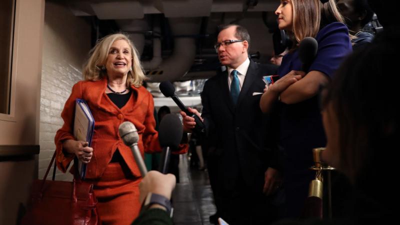 Congresswoman Carolyn Maloney (D-N.Y.) walks by reporters in the Capitol basement
