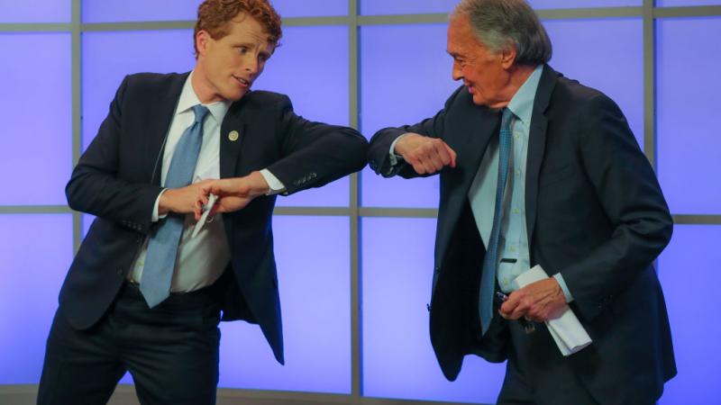 Rep. Joe Kennedy and Senator Ed Markey elbow bump at a June 1 debate
