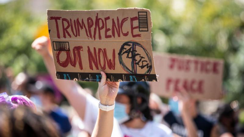 Trump/Pence Out Now sign