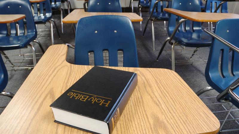 A Bible on a school desk