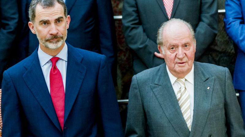 Former King Juan Carlos I of Spain and his son King Felipe VI