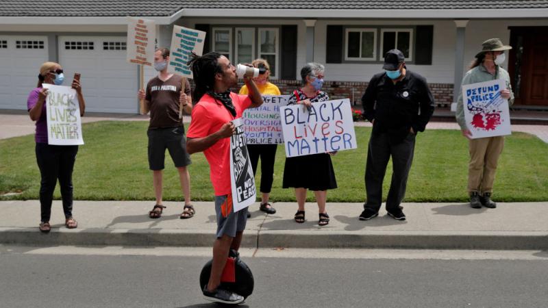 Black Lives Matter protestors gather in front of the home of the Contra Costa Sheriff
