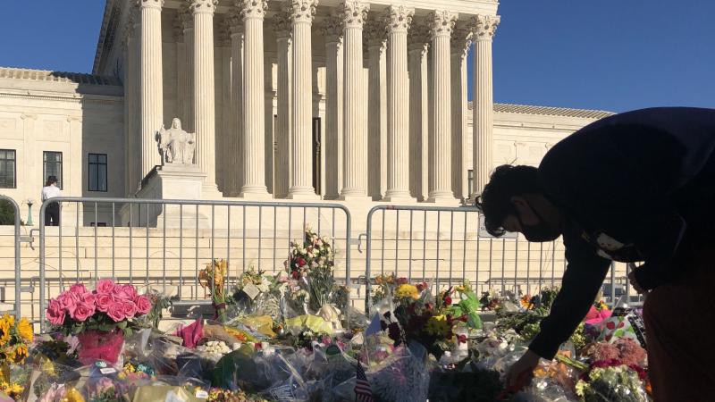 Flowers and candles at Supreme Court honoring Justice Ruth Bader Ginsburg 