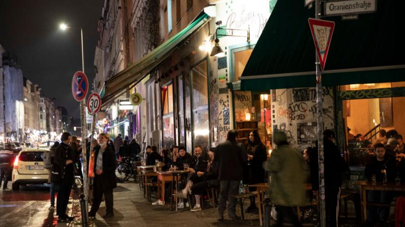 Bargoers in Berlin, Germany, Oct. 16