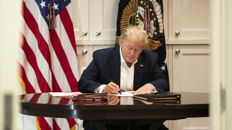 President Donald J. Trump works in the Presidential Suite at Walter Reed National Military Medical Center in Bethesda, Md. Saturday, Oct. 3, 2020, after testing positive for COVID-19.
