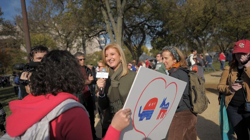 Founder of the Huffington Post Arianna Huffington interviews rally goers attending the "Rally to Restore Sanity and/or Fear" on October 30, 2010 in Washington, DC.