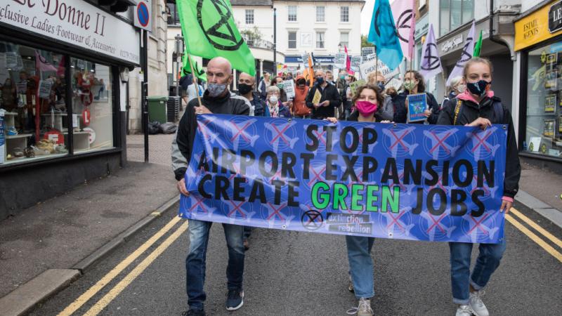 Climate activists from Extinction Rebellion attend a protest against the expansion of Stansted Airport on 29 August 2020 in Bishop's Stortford, United Kingdom.