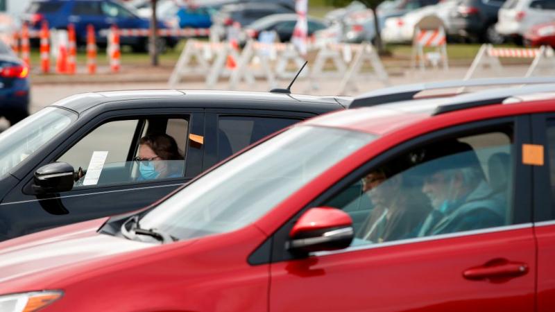 People cast vote from car.