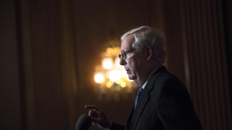 Senate Majority Leader Mitch McConnell (R-KY) answers questions from reporters during a news conference following the weekly meeting with the Senate Republican caucus at the U.S. Capitol on December 15, 2020 in Washington, DC.