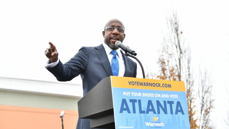 Raphael Warnock, U.S. Democratic Senate candidate, speaks during his Souls To The Polls Drive-In Rally at Riverside EpiCenter on December 20, 2020 in Austell, Georgia.