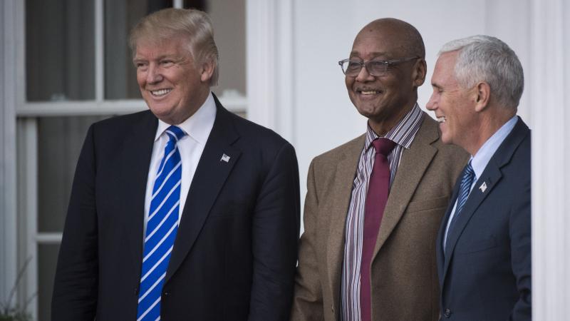 President-elect Donald Trump and Vice President-elect Mike Pence walk out with Center for Neighborhood Enterprises President Bob Woodson at the clubhouse at Trump National Golf Club Bedminster in Bedminster Township, N.J. on Saturday, Nov. 19, 2016.