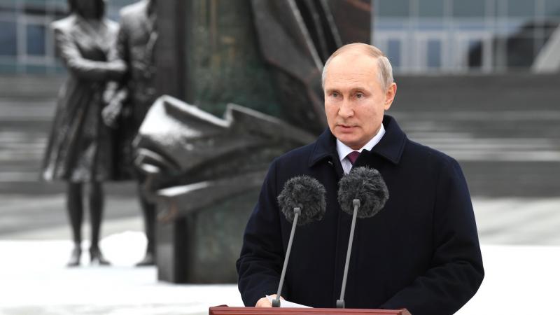 Vladimir Putin addresses members of spy agency