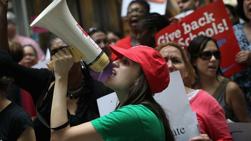 Sarah Chambers leads a teacher protest in Chicago, June 2011
