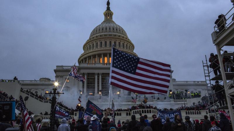Security forces respond with tear gas after the US President Donald Trump's supporters breached the US Capitol security.