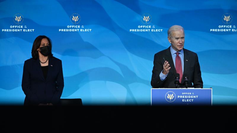 US President-elect Joe Biden with US Vice President-elect Kamala Harris (L) answers questions from the media after announcing key nominees for their economic and jobs team at The Queen theater in Wilmington, Delaware on January 8, 2021