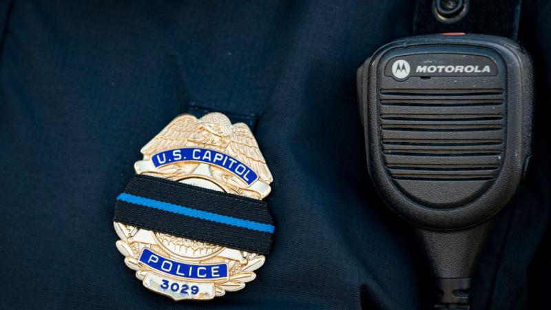 U.S. Capitol Police officer with mourning band over badge on January 10, 2021