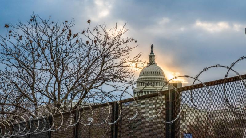 Razor wire and fences surrounding the U.S. Capitol on January 23, 2021