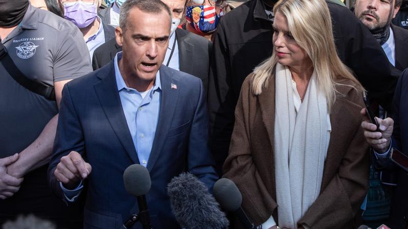 Former campaign adviser to U.S. President Donald Trump, Corey Lewandowski (L) and former Florida Attorney General Pam Bondi speak to the media about a court order giving President Trump's campaign access to observe vote counting operations on November 5, 2020 in Philadelphia, Pennsylvania.