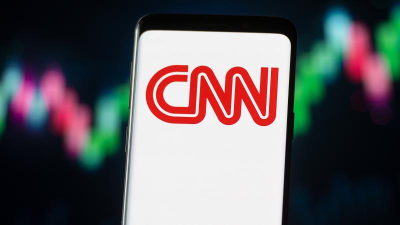 In this photo illustration a CNN logo seen displayed on a smartphone.