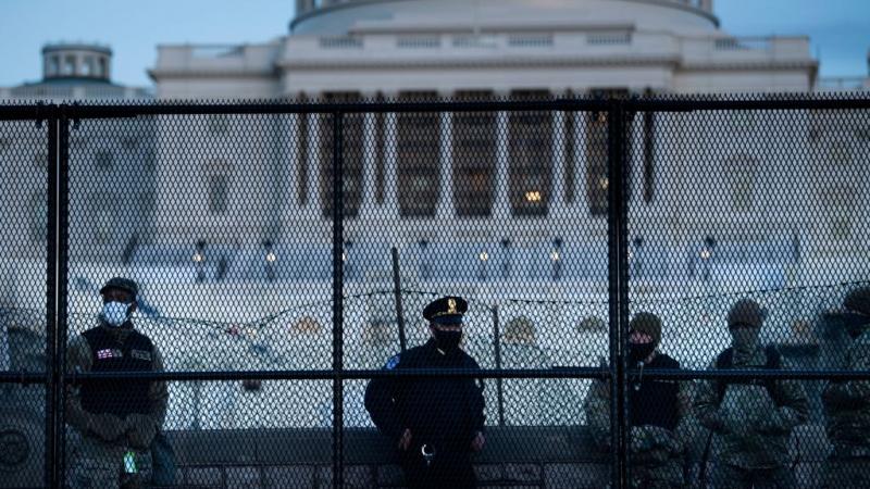 Capitol Police officer with members of National Guard on Jan. 7, 2021