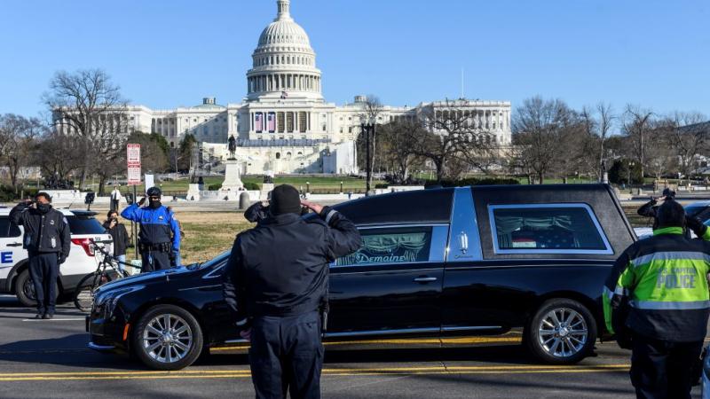 US Capitol Police salute as casket of Brian Sicknick passes on Jan. 10, 2021
