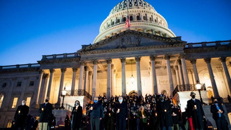 Members of Congress at candlelight ceremony on Feb. 23, 2021