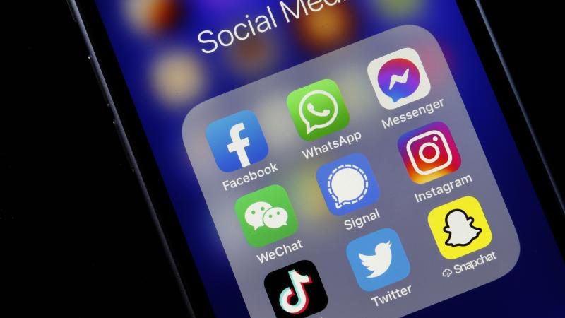 In this photo illustration, the logos of social media applications, Facebook, WhatsApp, Messenger, WeChat, Signal, Instagram, TikTok, Twitter and Snapchat are displayed on the screen of an iPhone on January 11, 2021 in Paris, France.