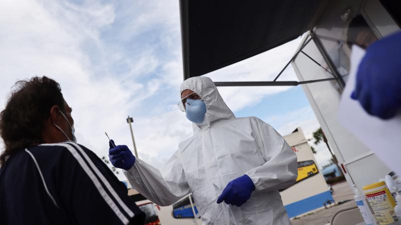 Medical workers administer rapid Covid-19 tests amongst the agricultural community on February 17, 2021 in Immokalee, Florida.