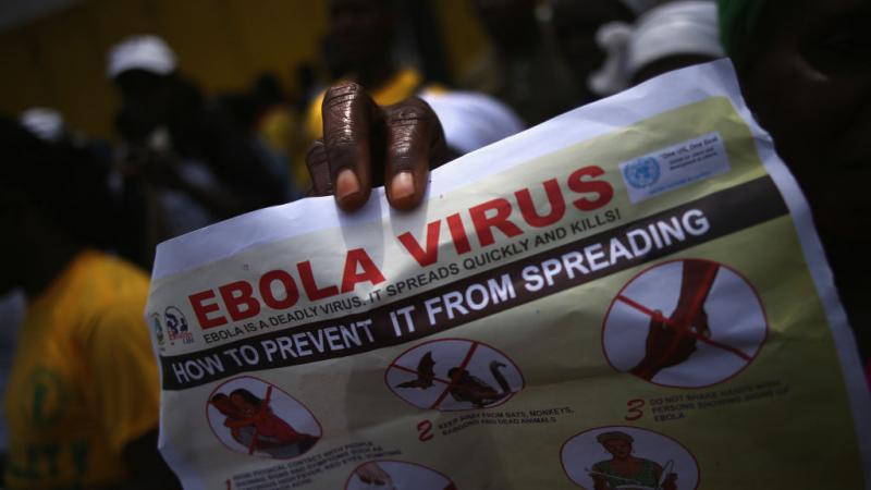 People stage Ebola awareness and prevention event in Liberia in 2014