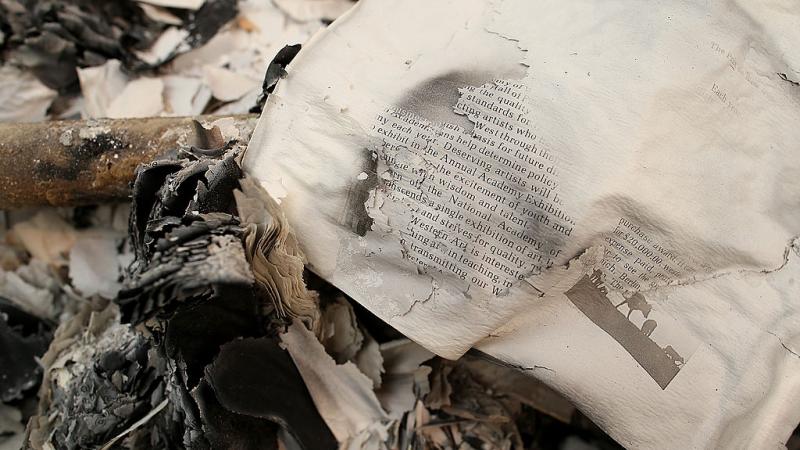 A burned book destroyed and turned to ash.