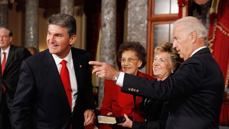 West Virginia Sen. Joe Manchin (left) with President Biden.