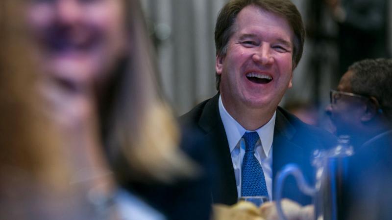 Supreme Court Justice Brett Kavanaugh laughs at a conference in D.C., 2019