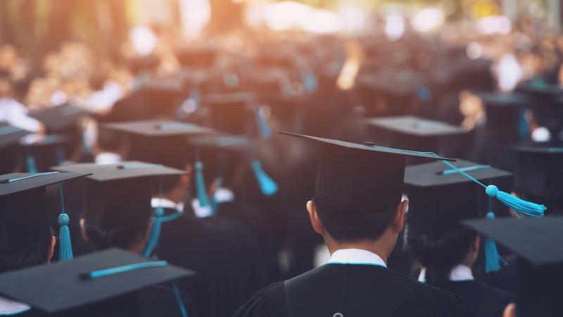 Graduates in cap and gown GettyImages