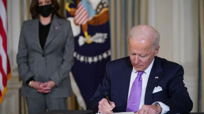 President Joe Biden signing an executive order