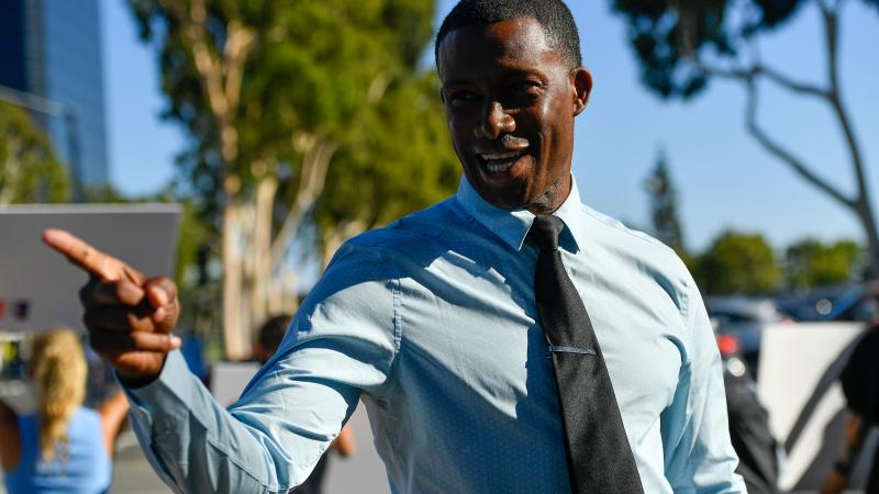 Major Williams, a candidate for a California Governor, visits with People protesting coronavirus (COVID-19) salon closures by California Governor Gavin Newsom at the corner of Sunflower Avenue and Bristol Street in Costa Mesa, CA, on Aug., 10, 2020.