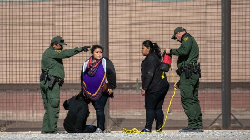 U.S. border patrol agents apprehend illegal immigrants at the southern border